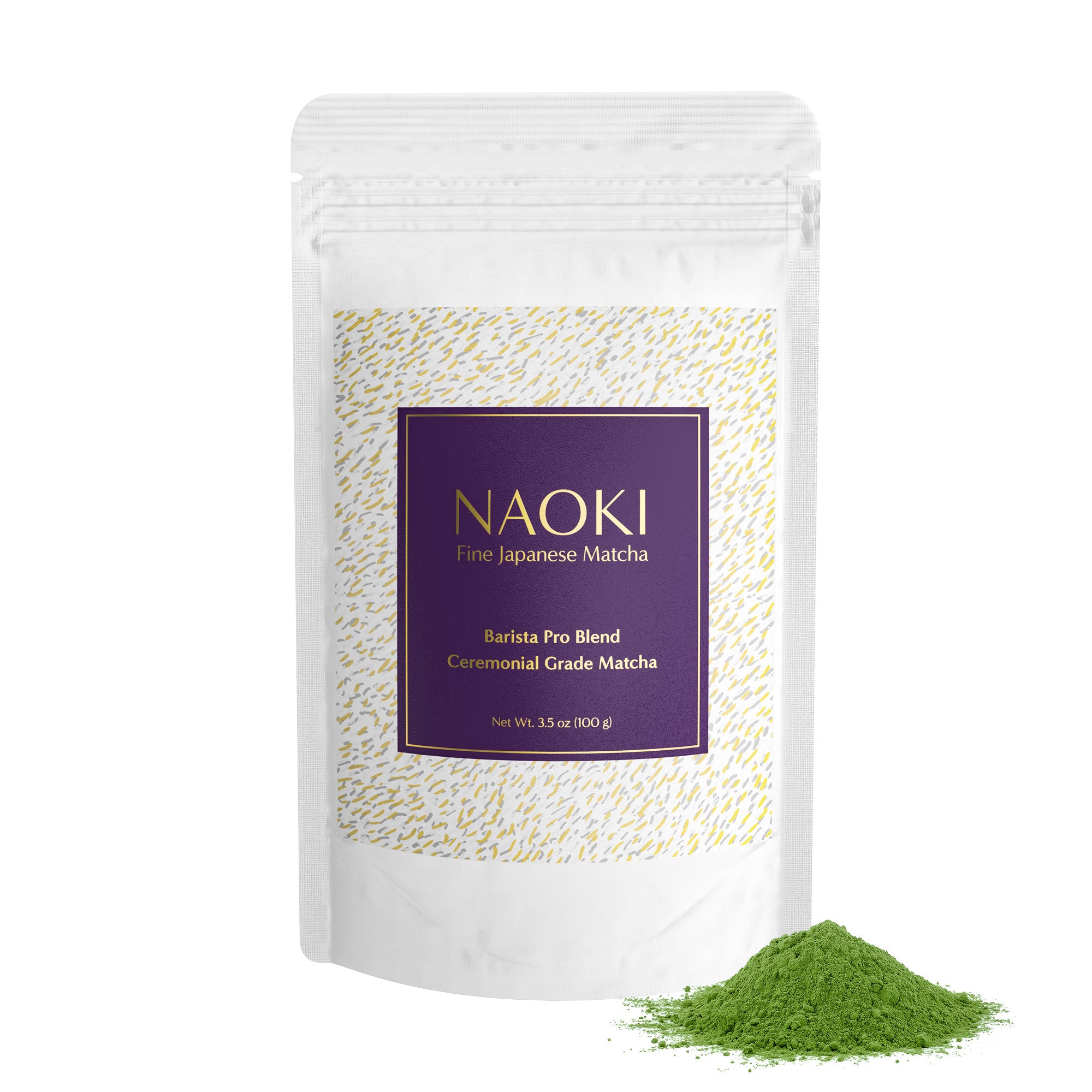 Barista Pro Blend ceremonial grade matcha bag with a purple label and a pile of bright green powder nearby